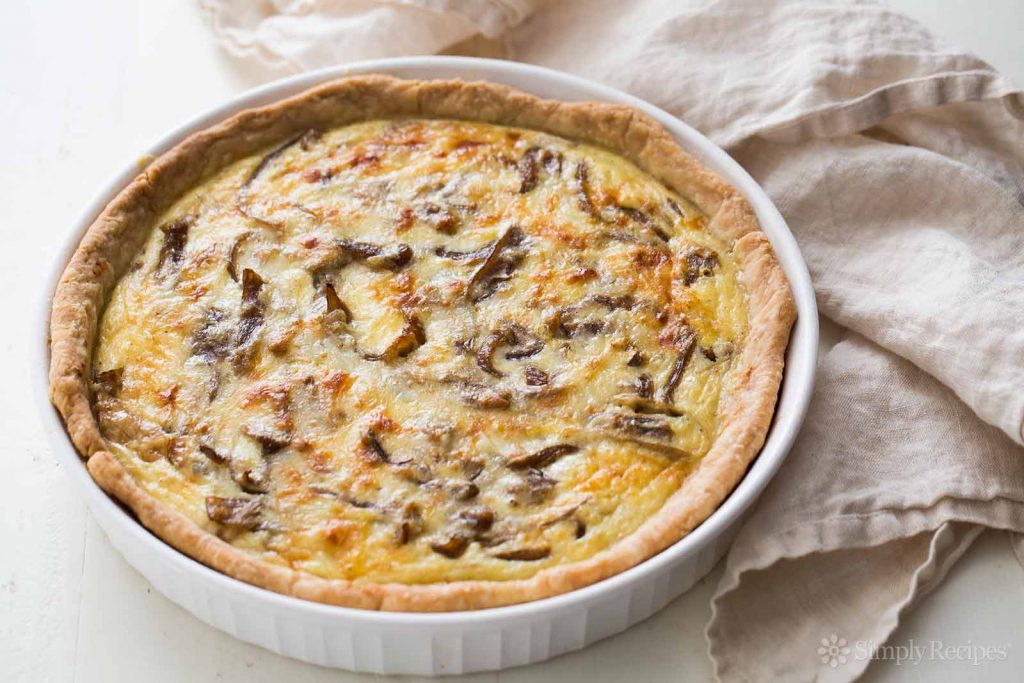 Caramelized Onion, Mushroom, Kale & Aged Gruyere Quiche, Recipe at Riot Material magazine.