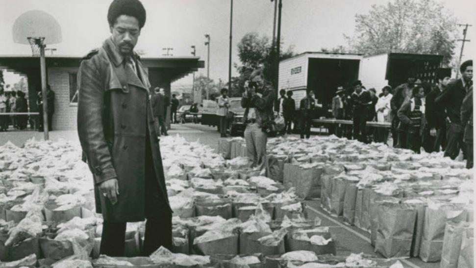 Bobby Seale Checks Food Bags. March 31, 1972.